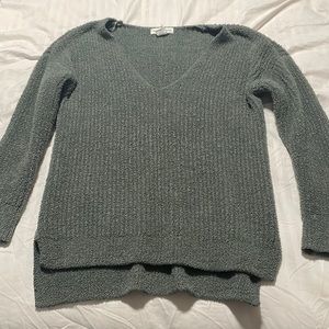 Green V-neck sweater
